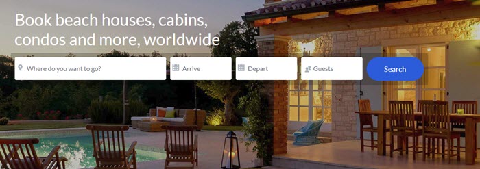HomeAway website screenshot showing an image of a vacation home with a pool, plenty of outdoor chairs and lighting.