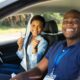 young black woman passing a drivers test with a black driving instructor representing the best african american affiliate programs