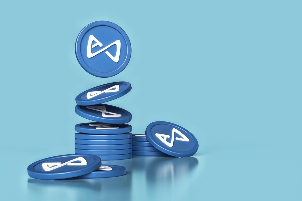 axie infinity tokens virtual render showing stacks of blue tokens. AXS is the main cryptocurrency associated with axie infinity