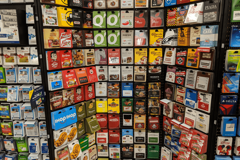 wall rack of gift cards to potentially buy and sell for profit