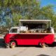 mobile bar in a red/white van sitting on the beach