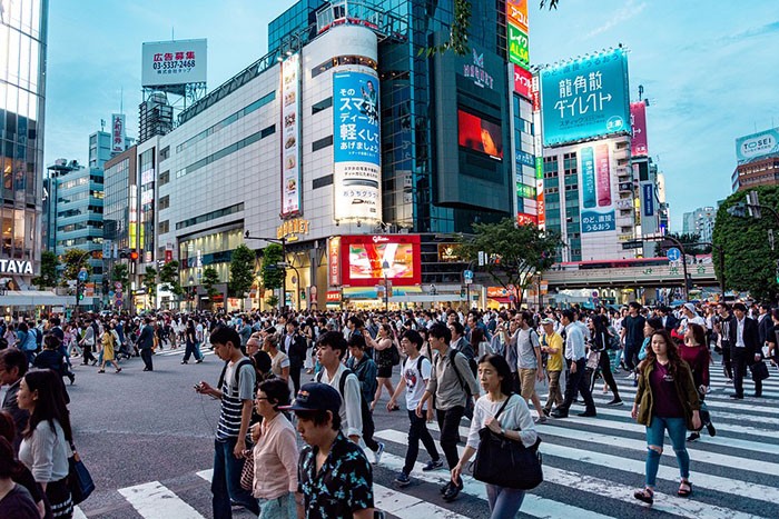 Workers walking the busy streets of Japan as an example of jobs for Americans