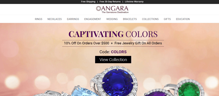 安加拉的网站使用桃色背景和失焦灯光。该公司有各种各样的戒指，上面有明亮的石头，周围有钻石。文字讲述了迷人的颜色，以及折扣。