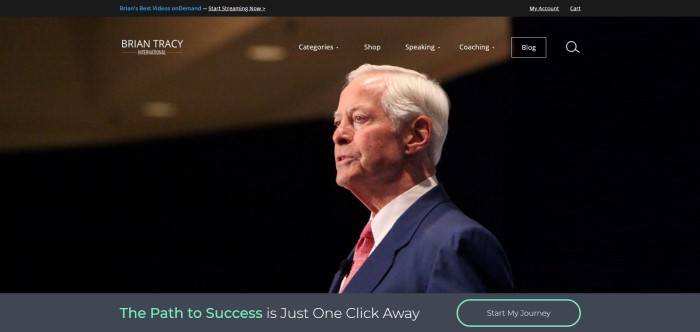 This screenshot of the home page for Brian Tracy shows a photo of Brian Tracy from the side, while he appears to be speaking to a large group of people.