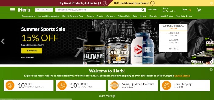 This screenshot of iHerb's home page shows a green background with mostly white lettering, and there is a photograph with a dark background and several bottles of iHerb supplements, along with a 15% summer sales pitch.