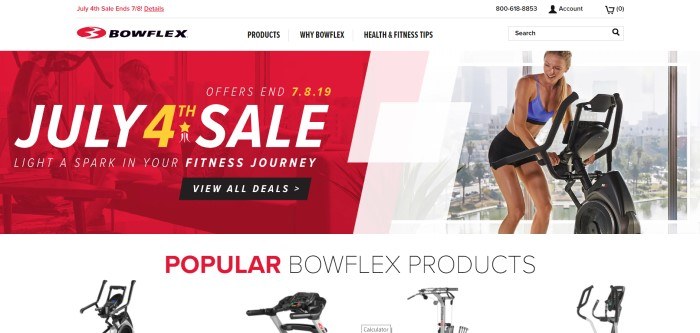 This screenshot of the home page for BowFlex has a white background, a red banner announcing a Fourth-of-July sale, a photo of a woman exercising on a piece of BowFlex equipment, and some photos of popular BowFlex products.