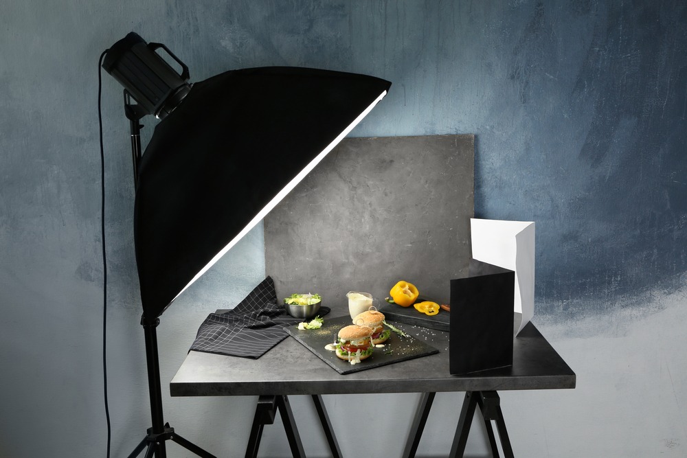 professional lighting with studio photographing food plated on slate