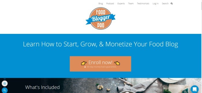 这张Food Blogger Pro主页的截图有一个白色的标题，中间是橙色和蓝色的标志，上面是一个蓝色的区域，上面有一个橙色的号召按钮和白色的文字，邀请顾客从他们的美食博客上学习如何做生意。