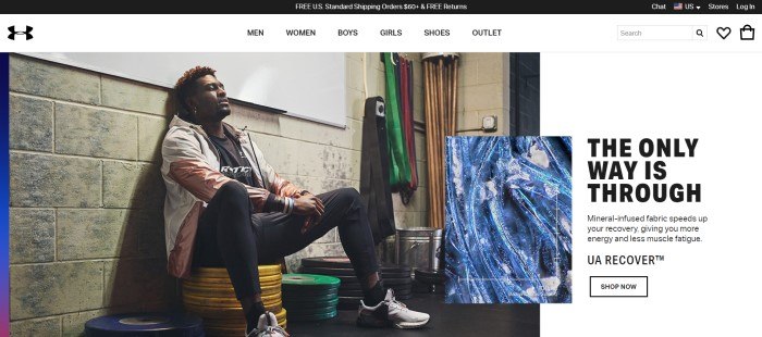This screenshot of the home page for Under Armour shows a dark-skinned man with black curly hair in black, white, and pink workout clothing resting on a stack of yellow weights against a gray brick wall, underneath a white board, in what appears to be the corner of a gym.