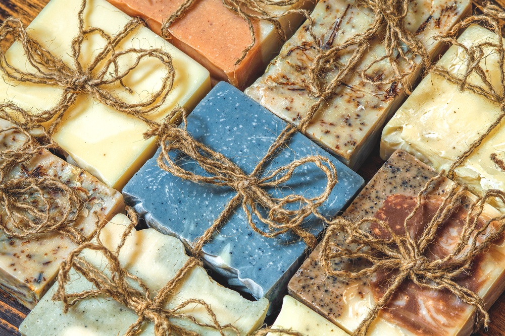 rustic handmade soap in various colors wrapped in twine