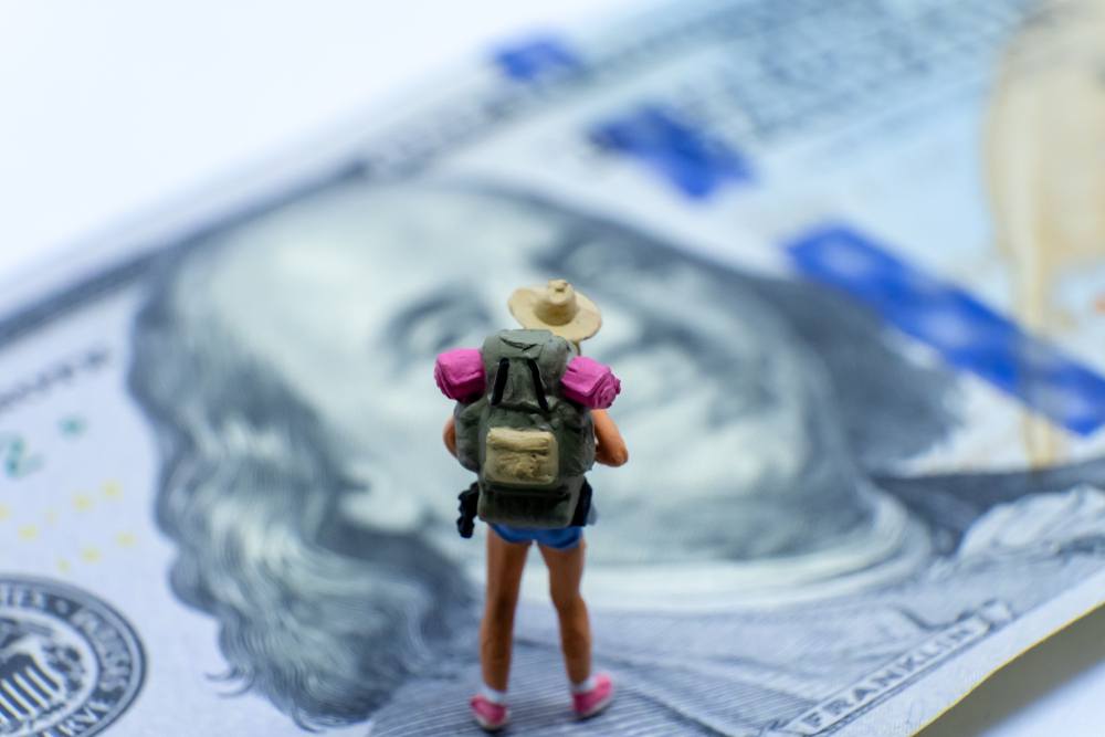 how much travel bloggers make concept figuring on dollar bill