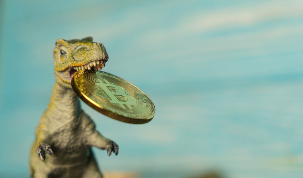 Dinosaur with bitcoin in mouth to represent risk of losing money