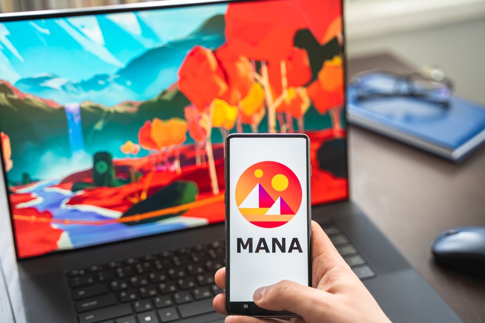 decentraland landscape on laptop with smartphone showing mana token cryptocurrency