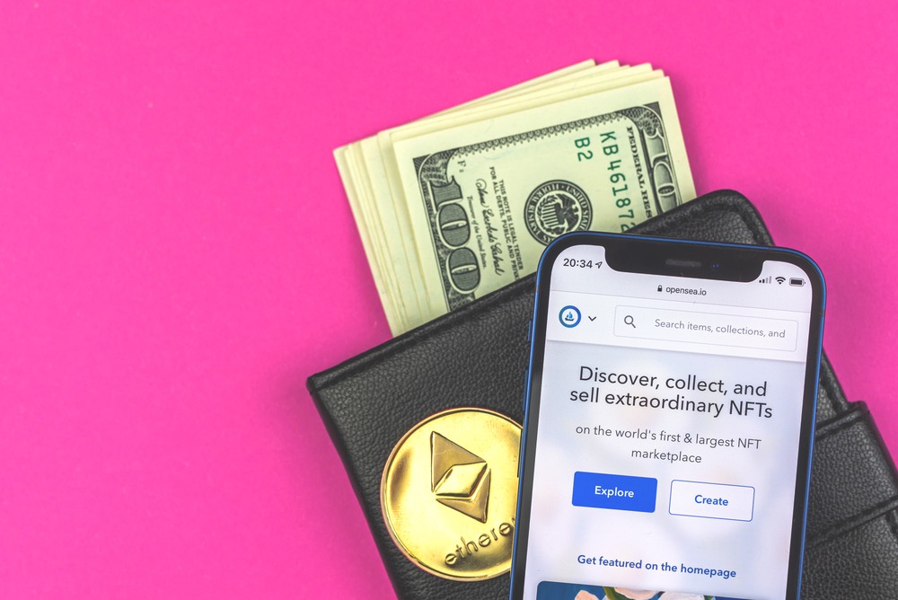opensea mobile app sitting on wallet full of $100 bills cash with ether coin