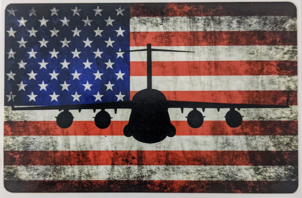 The silhouette of a bomber is superimposed over an American flag background.