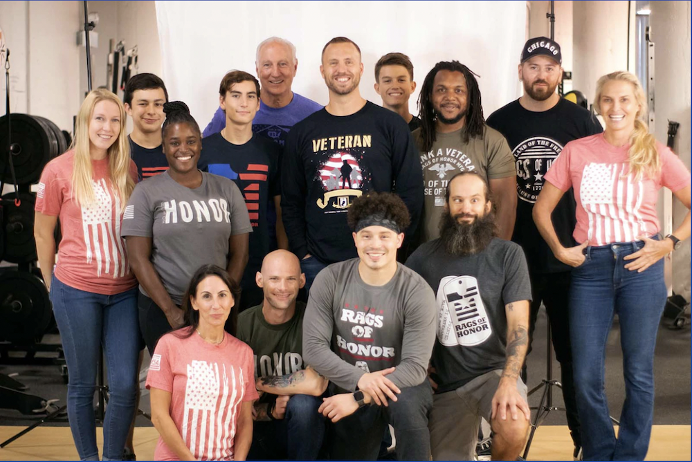 The employees of Rags of Honor, all former unemployed vets, pose foe a company photo.