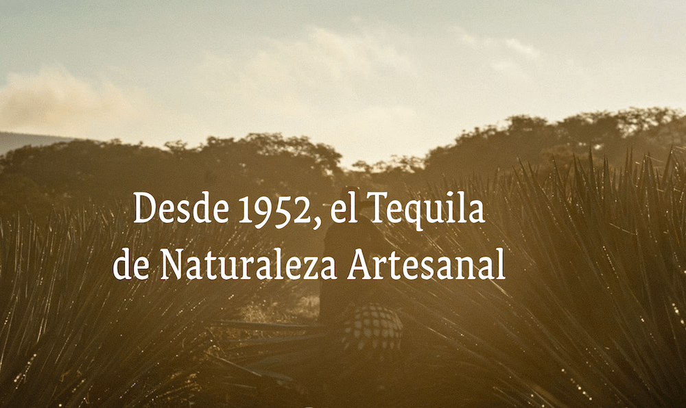 Since 1952 the natural artisanal tequila in Spanish is superimposed over a background of a sunset.