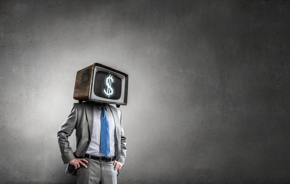 businessman with vintage TV on head and large dollar sign on screen
